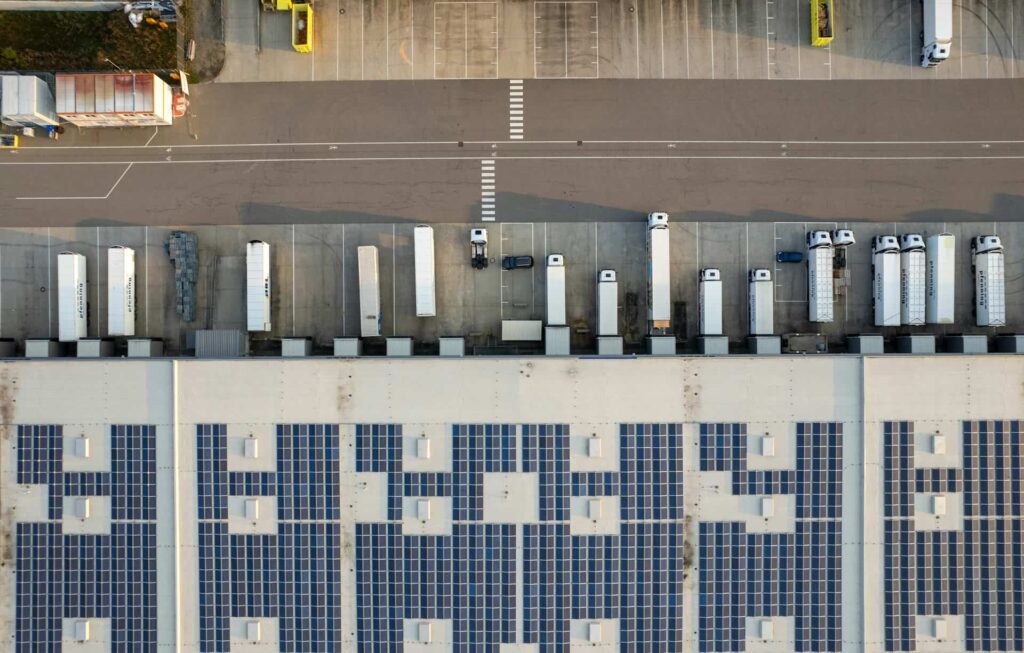 Aerial view of commercial rooftop solar mounting system on a warehouse building