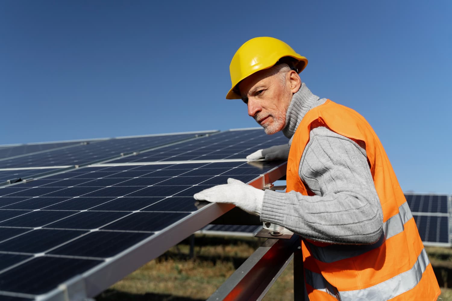Installer friendly solar mounting system being installed on a clean, aligned solar array.