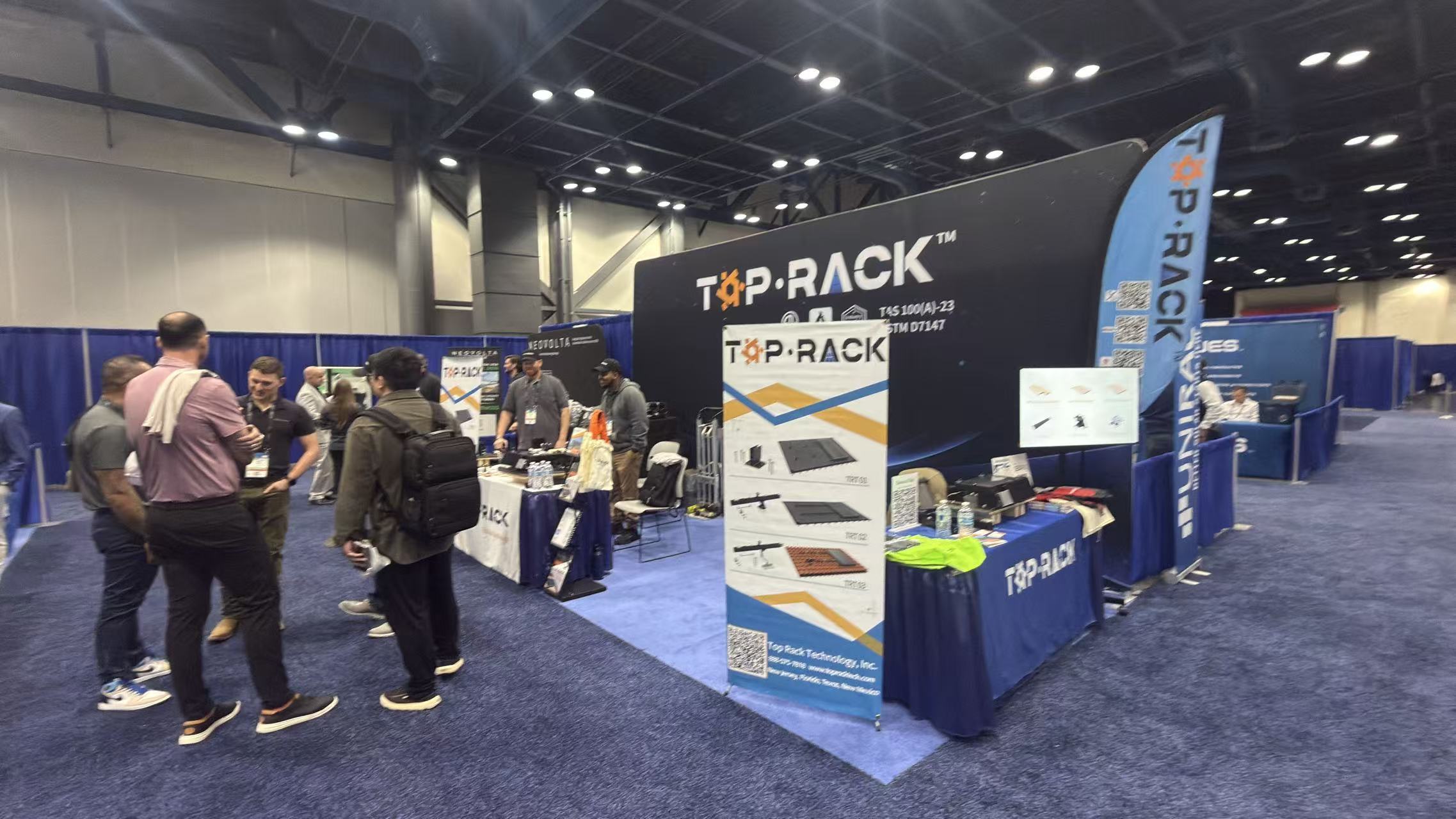 Top Rack RE+ Texas 2026 solar mounting solutions booth with visitors and installers in Houston
