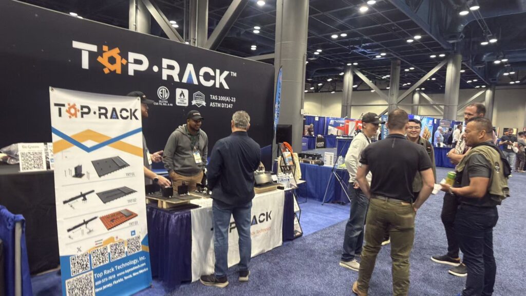 RE+ Texas 2026 solar mounting solutions - Top Rack solar mounting solutions booth at RE+ Texas 2026 in Houston with visitors and installers
